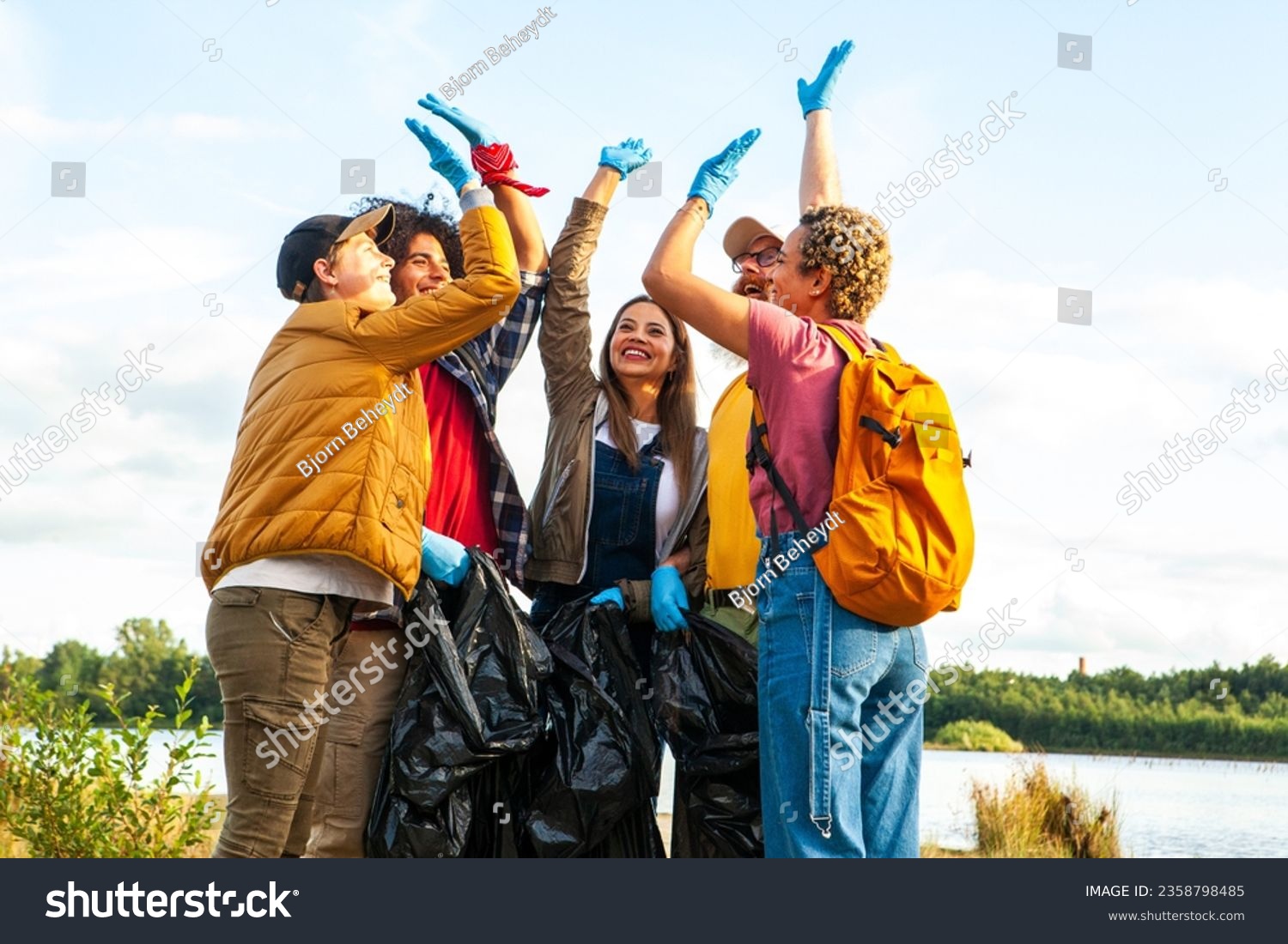 stock-photo-celebrate-the-spirit-of-environmental-stewardship-and-camaraderie-in-this-dynamic-image-a-diverse-2358798485